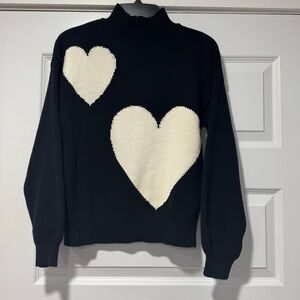 Black Mockneck Sweater with White Heart Design